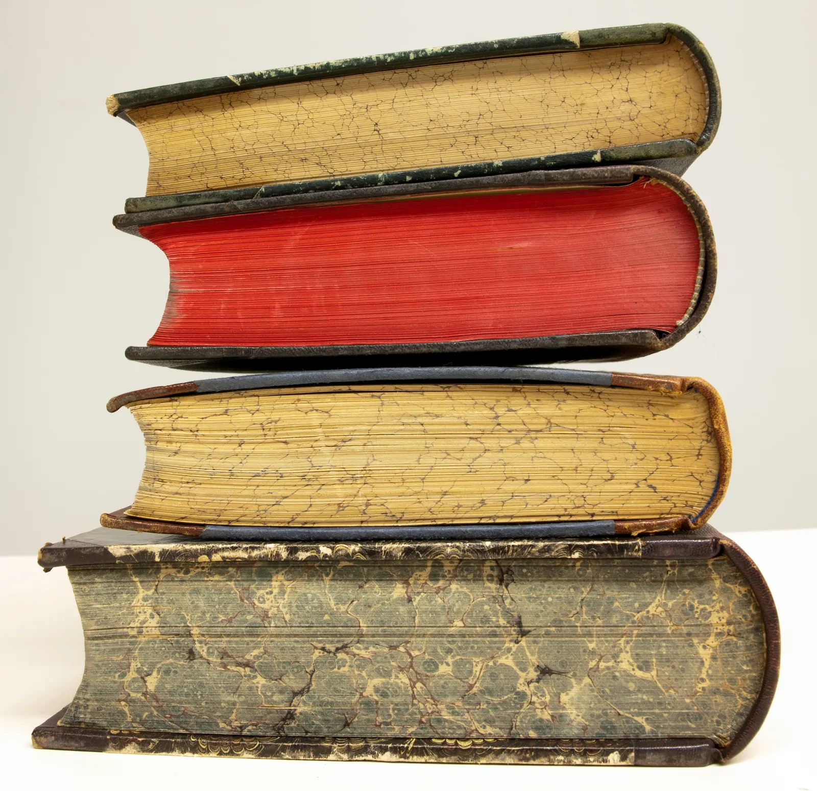 A stack of old leather-bound books