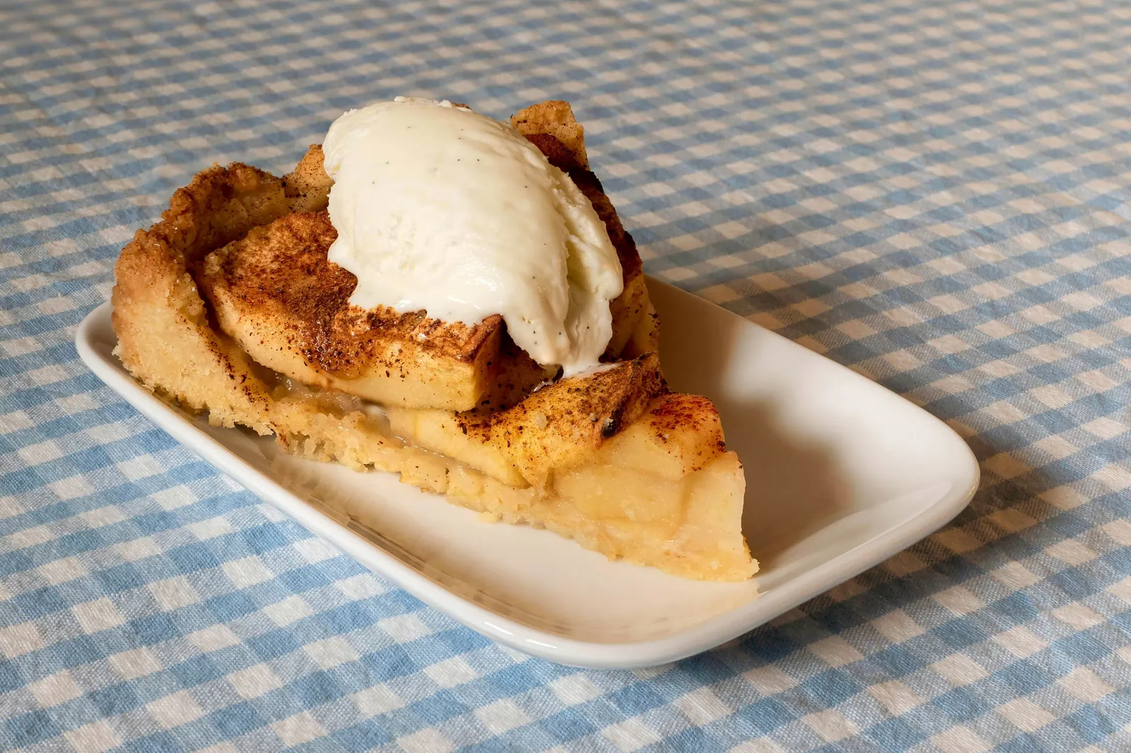 A slice of cake with ice cream