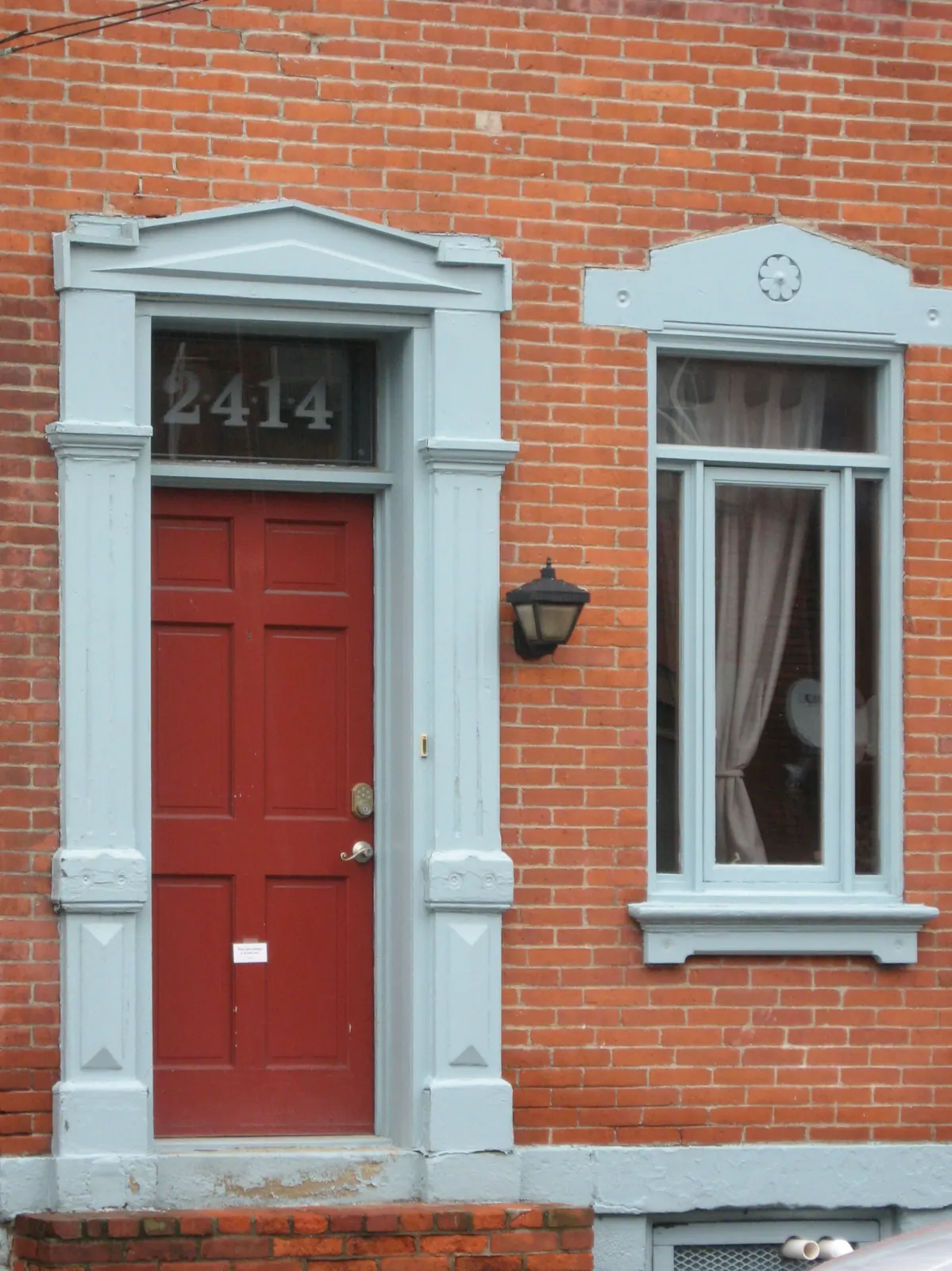 A painted front door with steps up to it