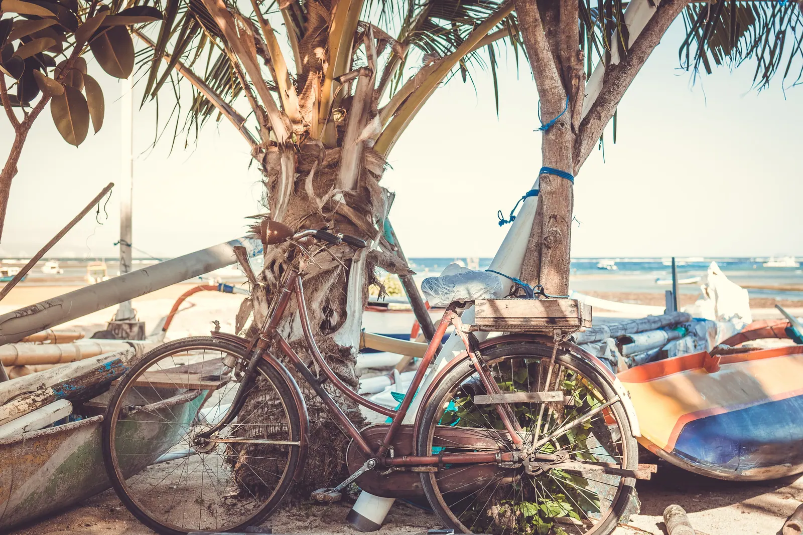 A vintage bicycle parked on a sunny beach