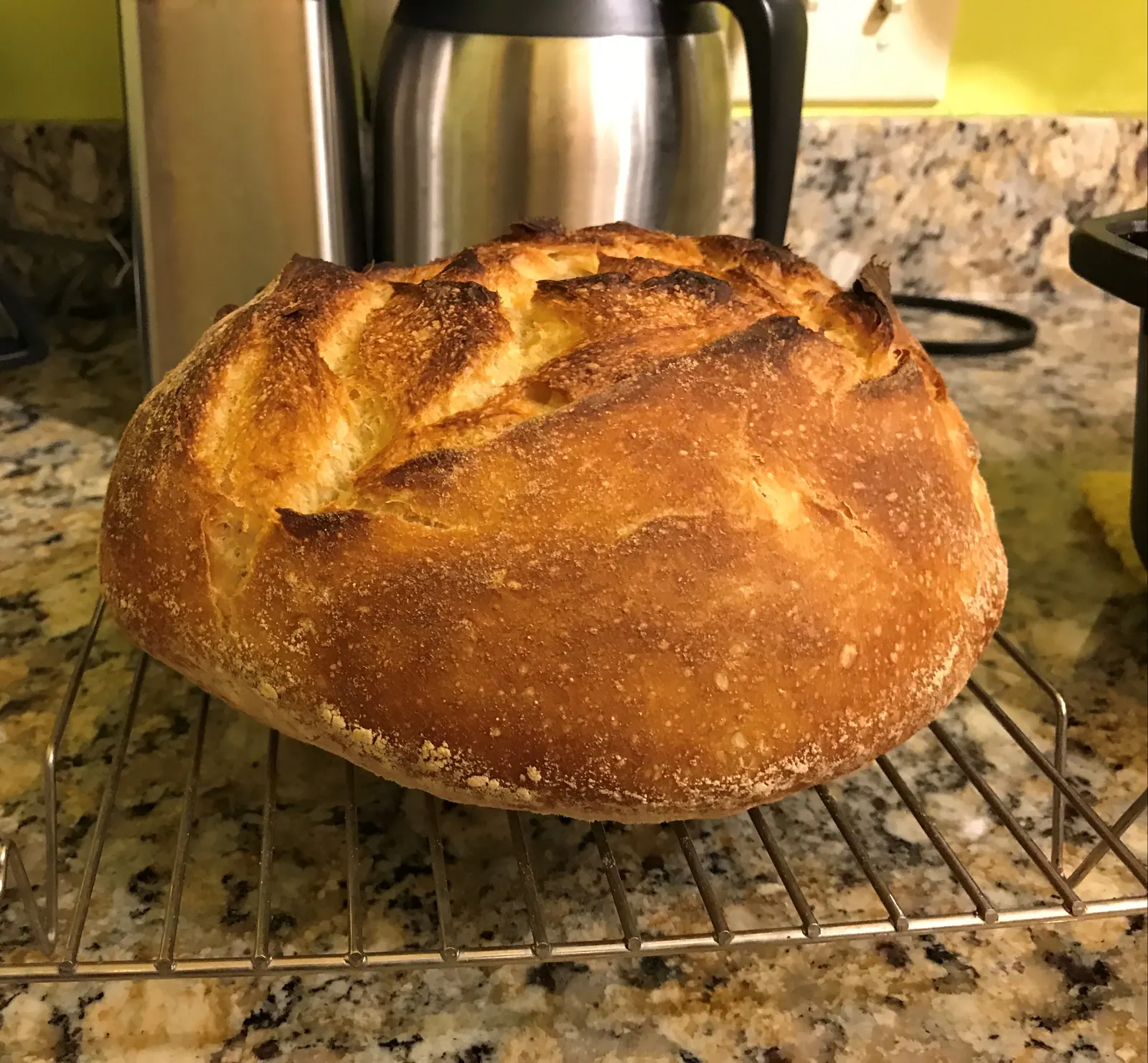 Loaves of sourdough cooling on a rack